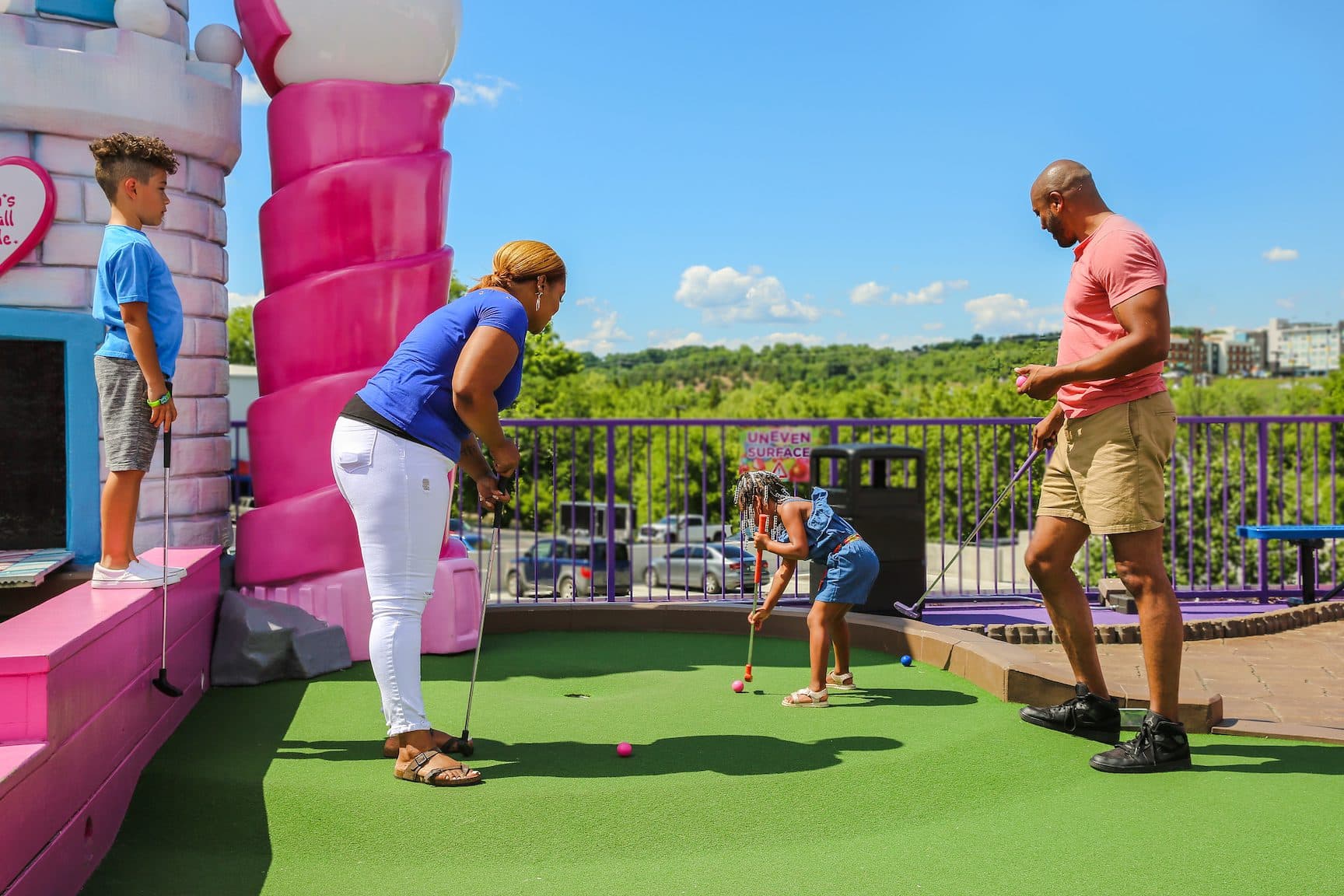 Family enjoying the putting experience