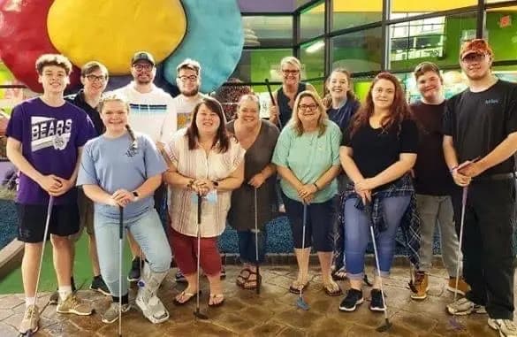 Group with golf clubs