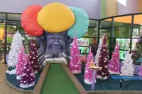 Christmas trees along Crave Golf Club indoor course