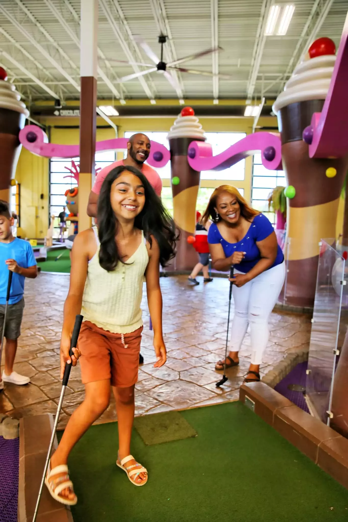 kids playing mini golf